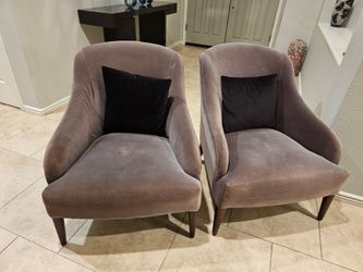 Matching gray chairs with black pillows