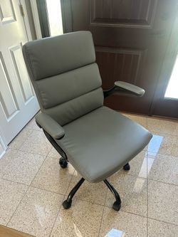 Gray office chair w/ chair cover