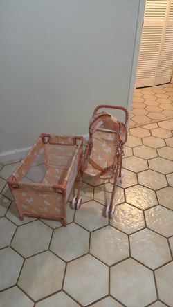 Set of 2 doll accessories: doll stroller and doll playpen.