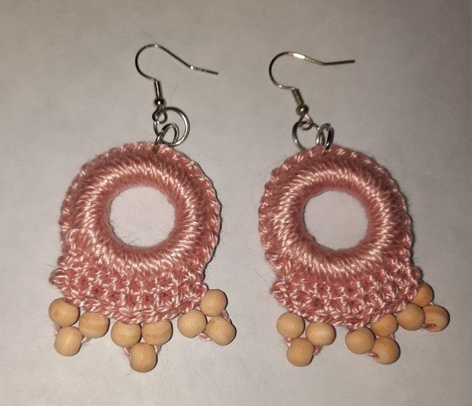 Peach-colored crocheted earrings