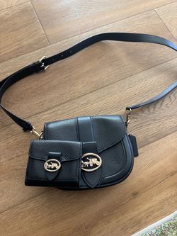 Black coach saddle bag