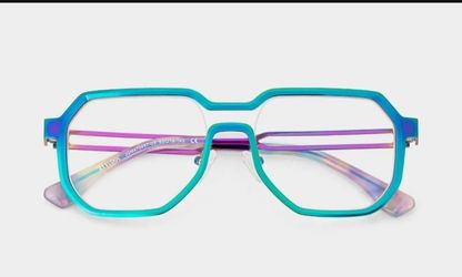 Vibrant iridescent geometric turquoise eyeglasses with a metal frame
