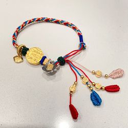 Handmade Tibetan braided adjustable string bracelet with Tibetan goddess and lucky pendant. 