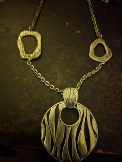 Long necklace with removable pendant.