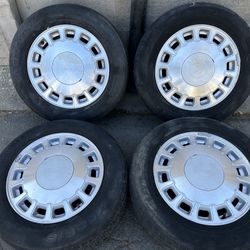 96-99 Cadillac Deville 16 inch aluminum wheels and caps. 5 on 115mm