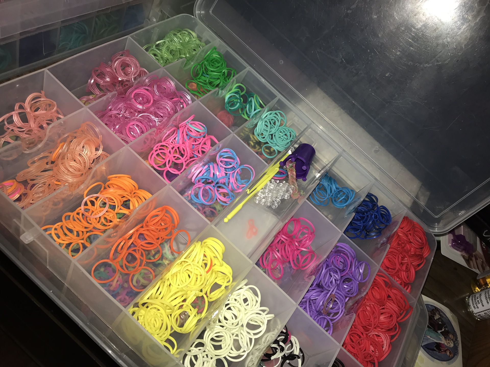 Rainbow loom bands with clips and crochet hooks