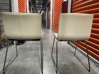 White leather dining chairs