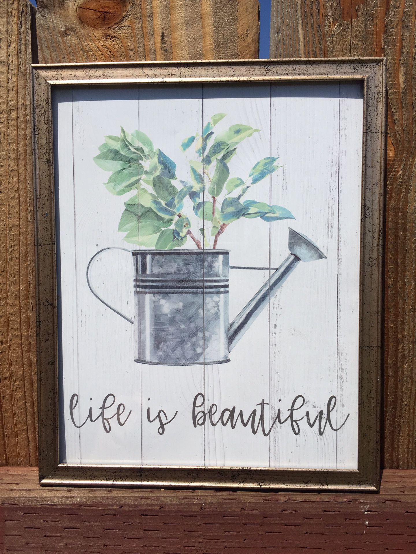 Beautiful Gold frame with flower pot says “life is beautiful”
