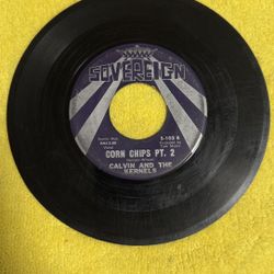 vintage 45 RPM vinyl record titled "Corn Chips Pt. 2" by the artist Calvin and the Kernels on the Sovereign labe
