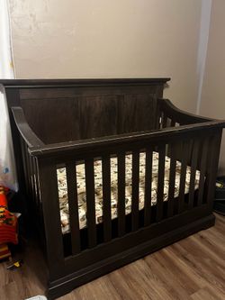 Pottery Barn dark wood baby crib