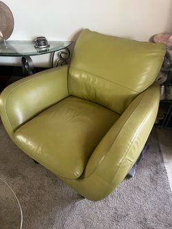 Pair of lime green leather Italsofa chairs and white and chrome bar stools.
