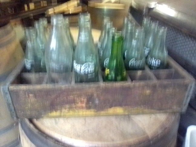 Old Wooden Coca-Cola Crate With Some Bottles