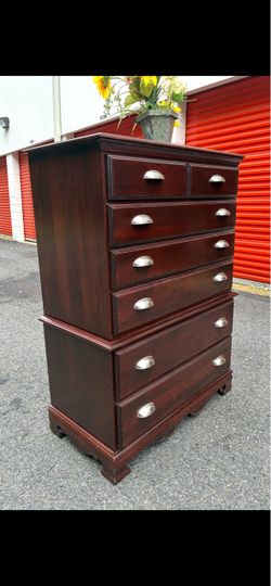 Modern solid wood tall chest with big drawers. Drawer sliding smoothly