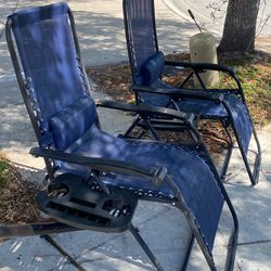 A set of 2 Zero gravity chairs in a pristine condition