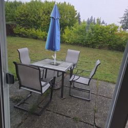 Out Door Table, Chairs, And Umbrella