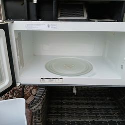 white Whirlpool over-the-range microwave, 