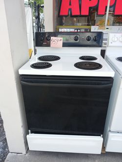 Kenmore coil top stove range oven white and black .Warranty . Delivery available . 2203 Fowler st. Ft. Myers 33901 1stop best appliances