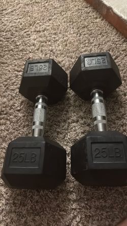 (2 )25 pound dumb bells