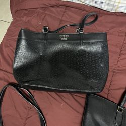 Black handbag by Guess.