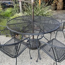 Heavy Duty Wrought Iron Patio Furniture Set. Table, 4 Chairs, & Umbrella with stand. In Good Condition. 