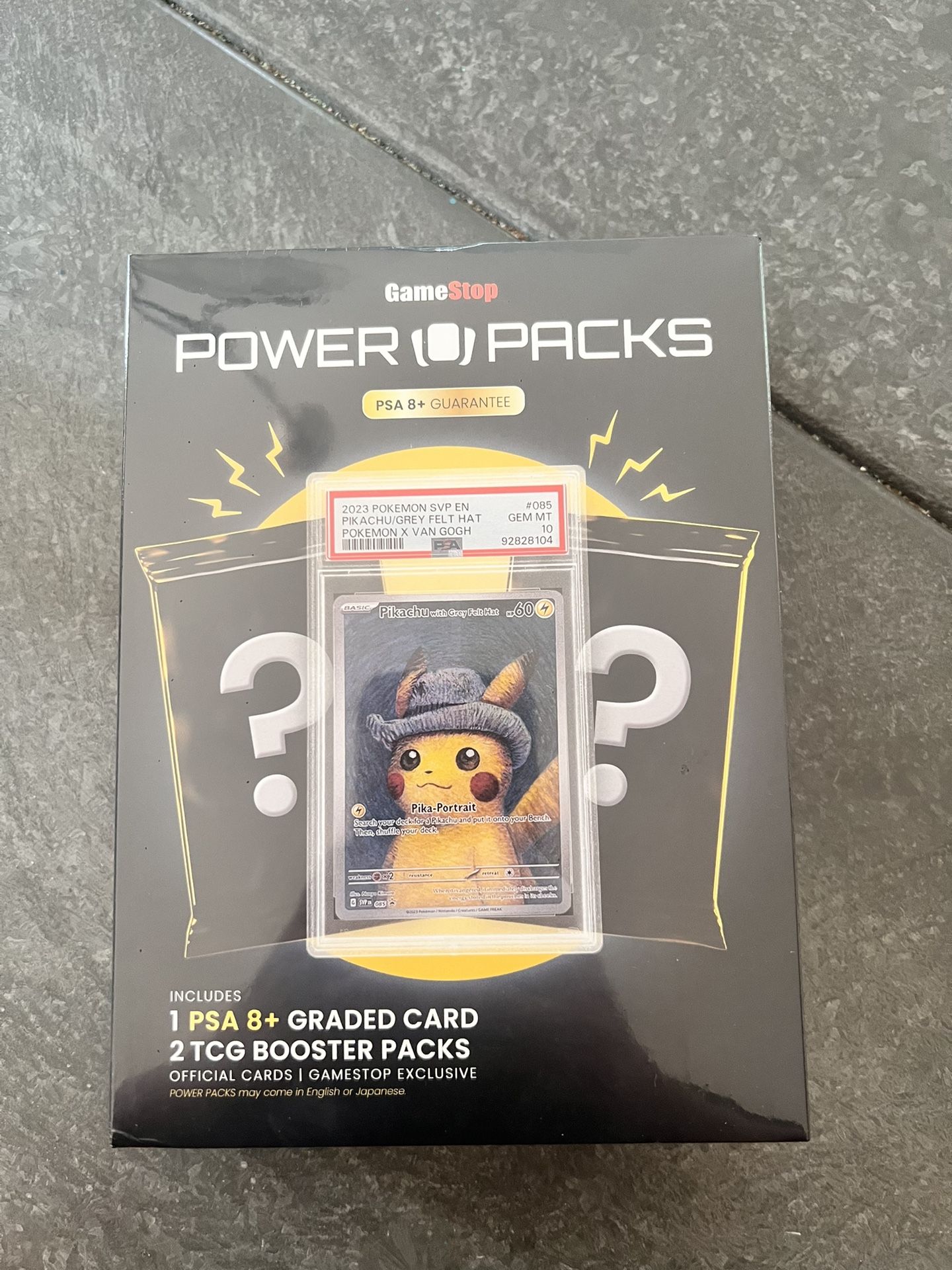 Sealed GameStop Pokémon Power Pack - 1 Graded Card + 2 Packs