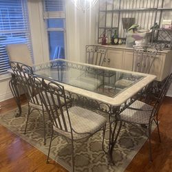 metal table with all its chairs