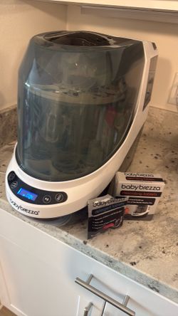 Baby Brezza bottle washer/ sterilizer with detergent tablets and descaling tablets