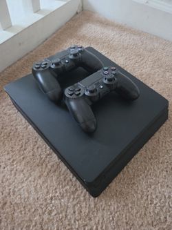 PlayStation 4 Slim Console with Two Controllers