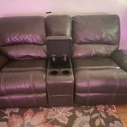 Real Leather Couch Very Good Condition. 2 Recliners And A Middle Part For Remotes And Cup Holders 