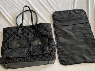 Diaper bag with a changing pad