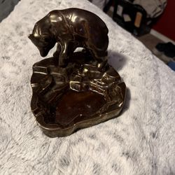 vintage brown ceramic or bronze-colored ashtray