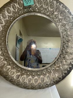 “Large round wall mirror, 25 dollars.