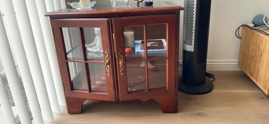 small cabinet with glass doors ( moving sale)