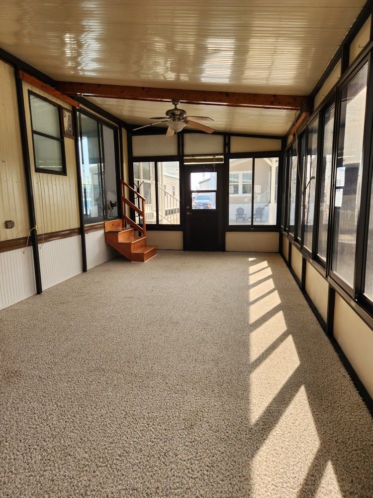 MANUFACTURED HOME AND PERIMETER LOT IN HOLIDAY CONDO PARK (16410 SAN CARLOS BLVD.)