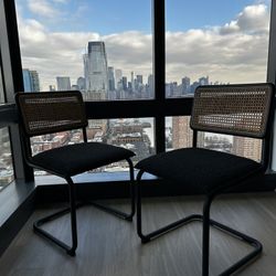 Pair of Black Upholstered and Cane Dining Chairs (Selling as Set)