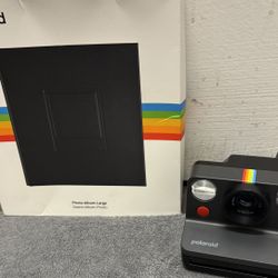 Polaroid camera with photo album
