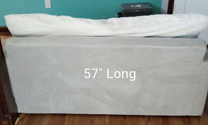 Light Gray-colored pull-out sleeper chair or loveseat bed.