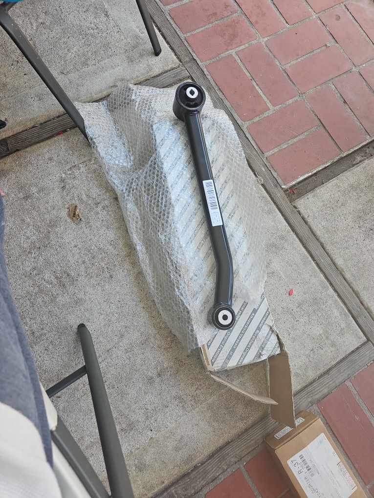 Arm, Driver Side Rear Trailing