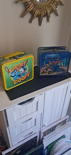 Goofy and He Man lunch boxes