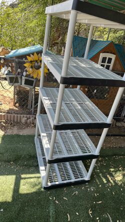 Plastic shelving unit 72 inches high by 36 inches long and 24 inches wide
