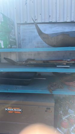Pallet of axes, shovel and machetes