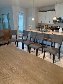 Gray Upholstered Dining Chairs with Black Legs