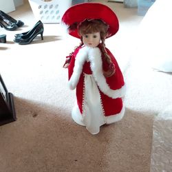BEAUTIFUL  RED AND WHITE PORCELAIN DOLL  GOOD CONDITION $ 10.00 