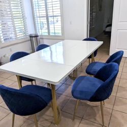 Beautiful modern and stylish wooden dining table with 4 new comfortable velvet chairs