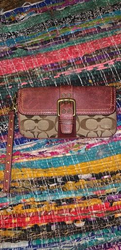 Brown leather coach wristlet