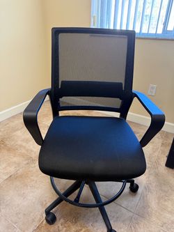 Barely used ergonomic mesh office chair.