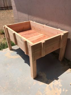 Raised wood planter