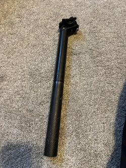 Black Bicycle Seatpost with Two-Bolt Saddle Clamp