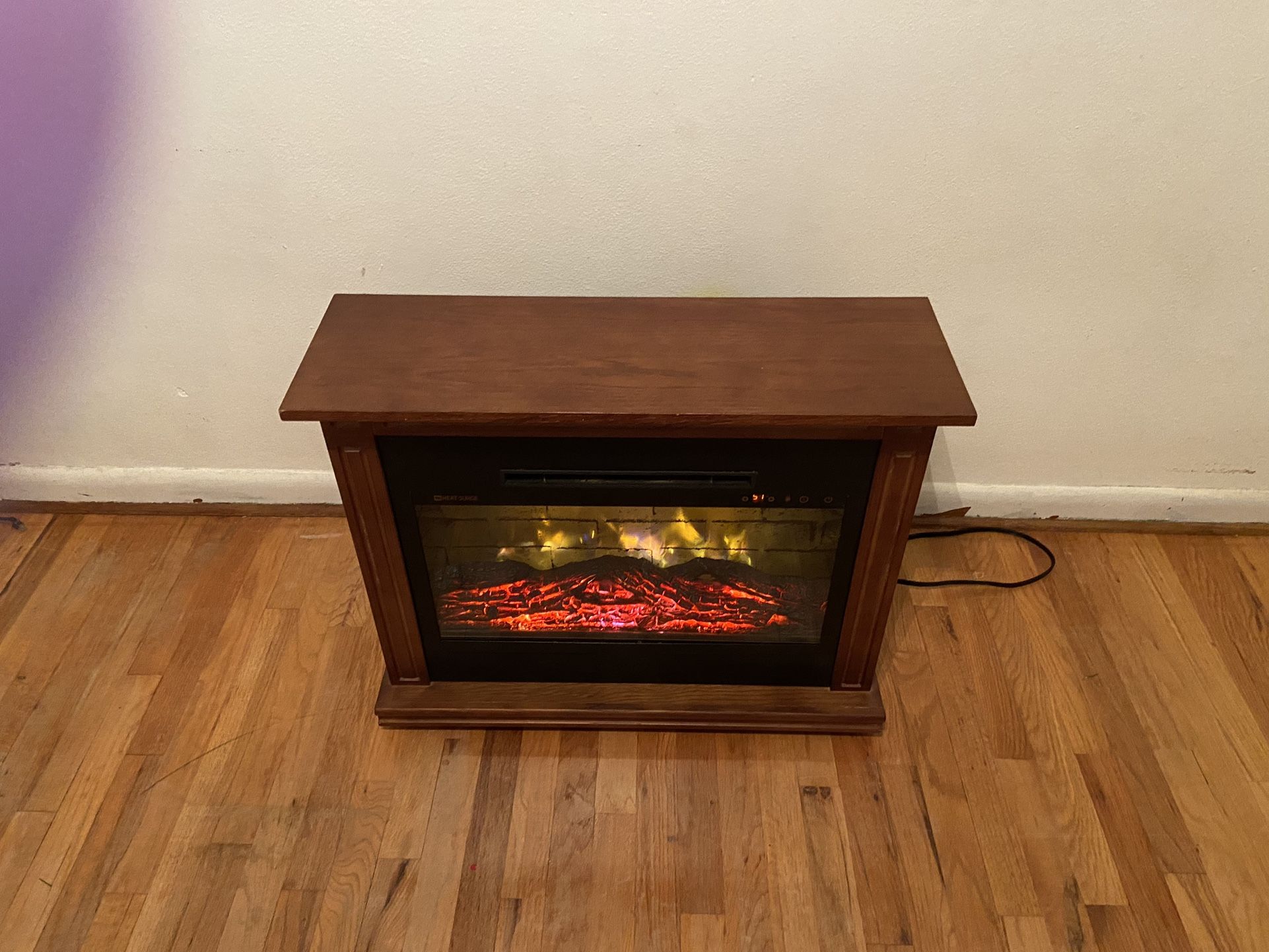 Heat Surge Roll N Go Electric Fireplace