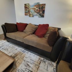 A modern black and khaki sofa in excellent condition. Stylish and comfy.